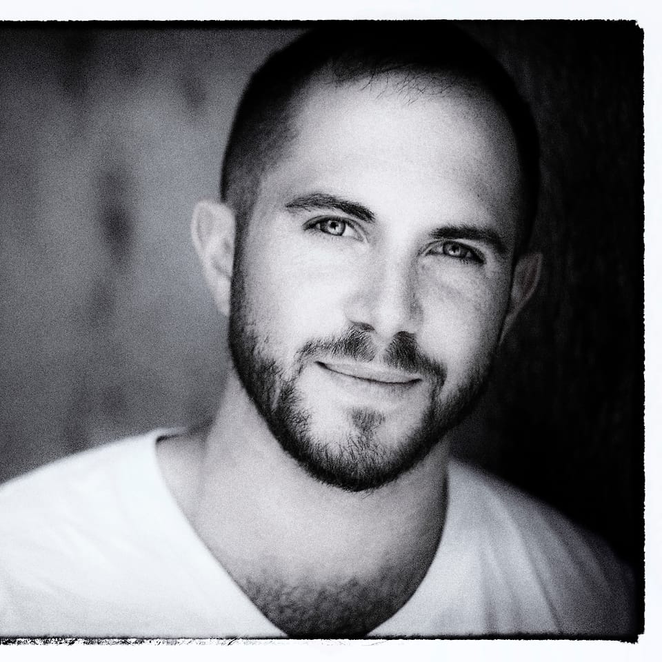 Black and white actor headshot of Jesse Rosen with a film-border finish