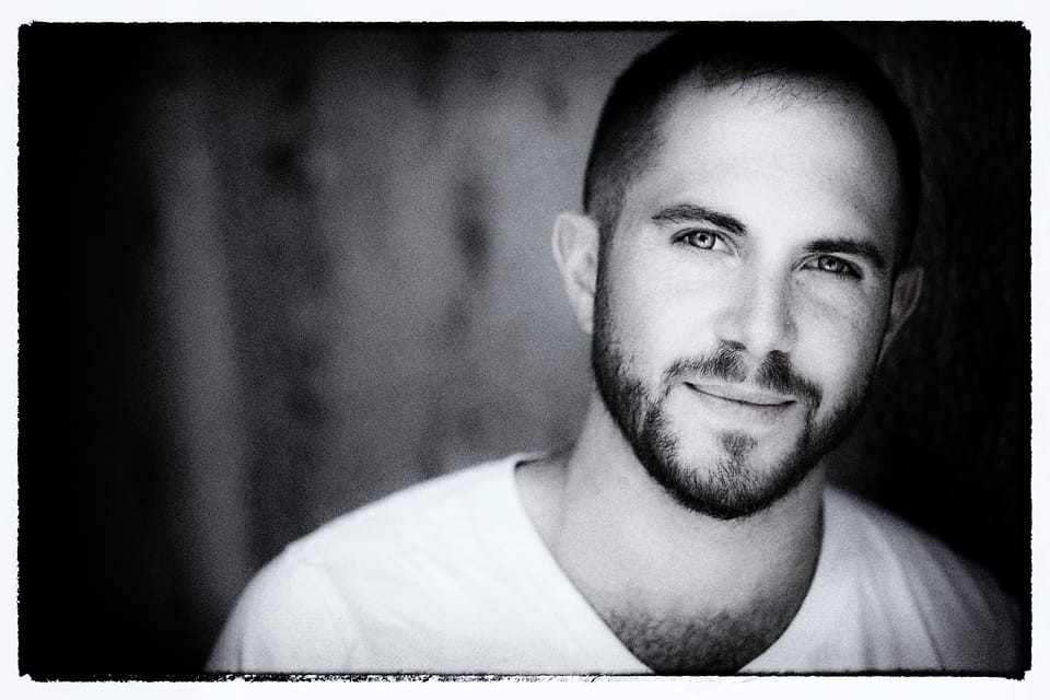 Black and white actor headshot of Jesse Rosen with a film-border finish