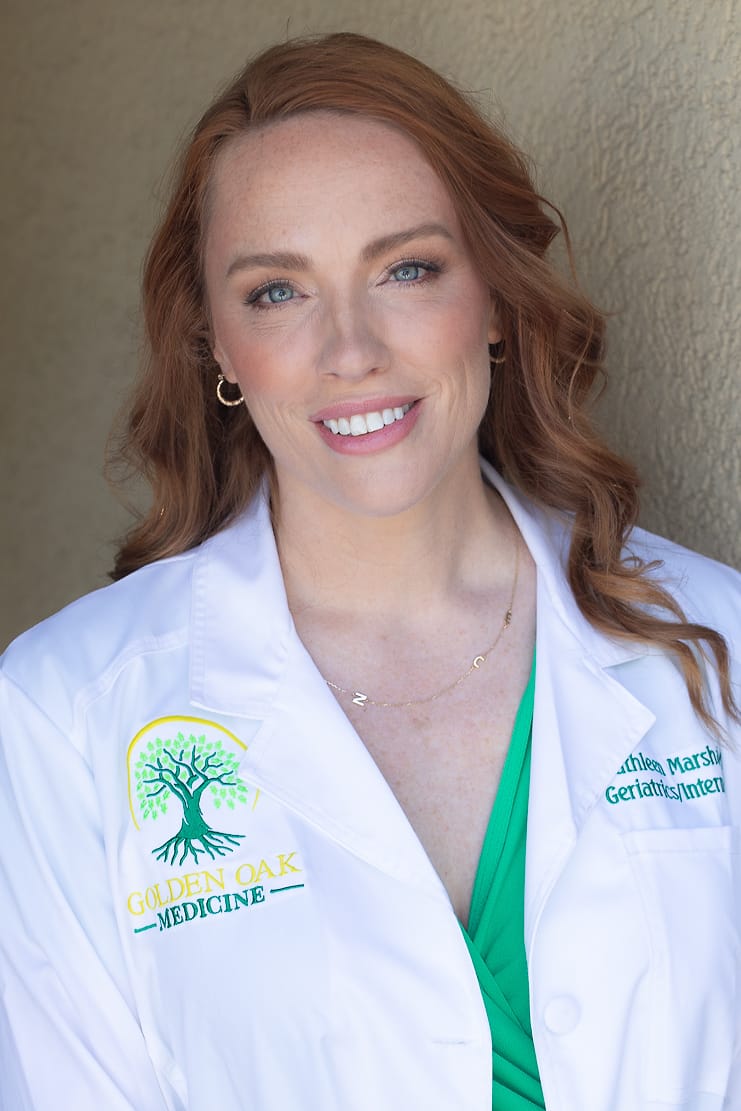On-location medical portrait in a Golden Oak Medicine coat, photographed on the client's premises