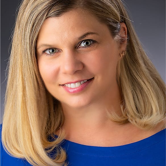 Personal branding portrait of a woman in a royal blue top