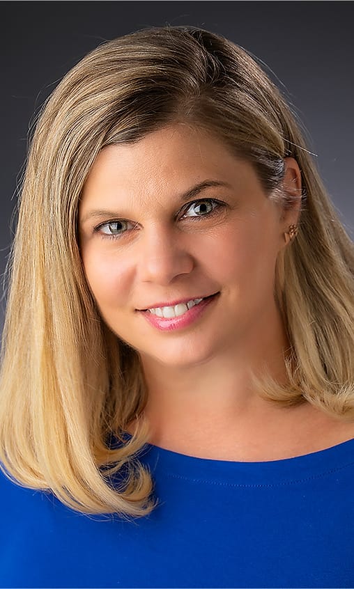Personal branding portrait of a woman in a royal blue top