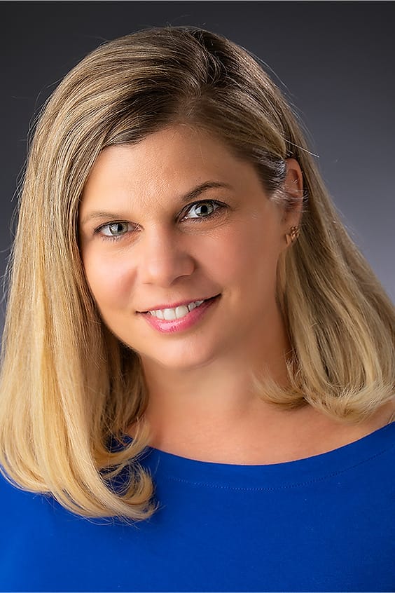Personal branding portrait of a woman in a royal blue top