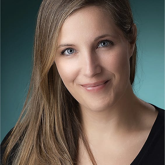 Studio branding portrait of a woman on a teal background