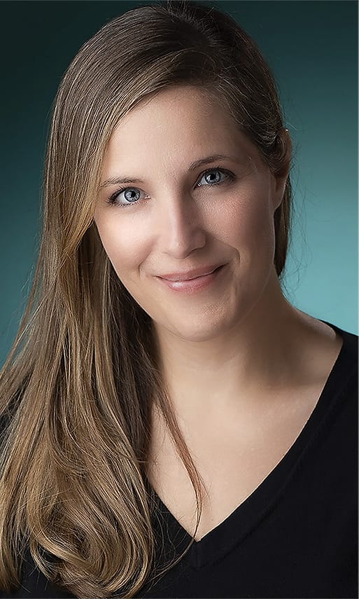 Studio branding portrait of a woman on a teal background