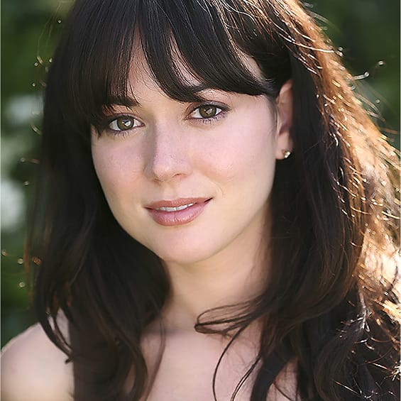 Natural-light actor portrait of a woman with bangs photographed outdoors