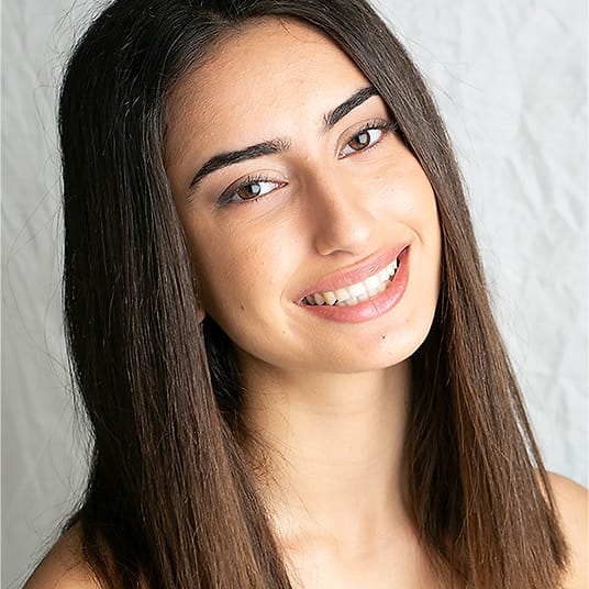 Editorial actor portrait of a young woman in an off-shoulder white top